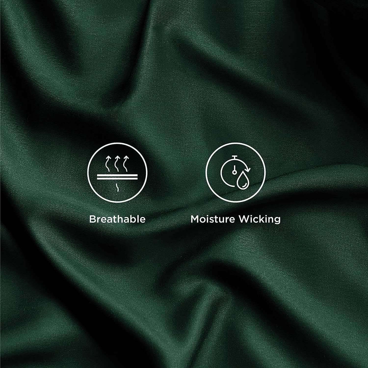 Close-up of dark green bamboo sheets, showcasing their silky smooth texture and luxurious drape. These bamboo bed sheets are ultra-soft, breathable, and hypoallergenic, designed for premium comfort and elegance.