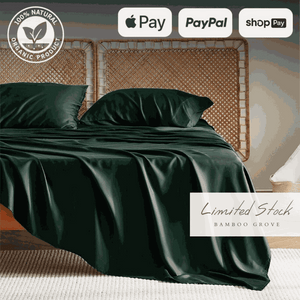 Luxurious dark green bamboo bed sheets draped over a bed, offering a sleek and elegant look. These bamboo sheets are ultra-soft, breathable, and hypoallergenic, providing exceptional comfort and durability for a restful sleep.