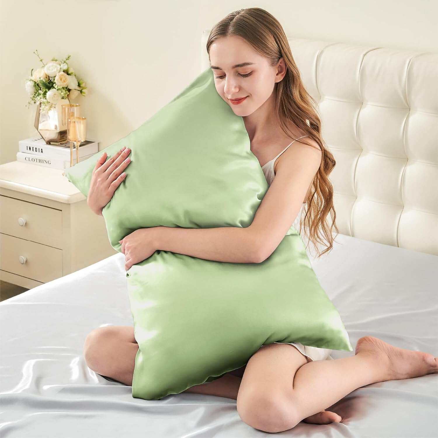 Woman embracing a luxurious light green silk pillow case, highlighting its ultra-soft and smooth texture. This silk pillow case is designed for ultimate comfort, hair protection, and a breathable, skin-friendly sleep experience.