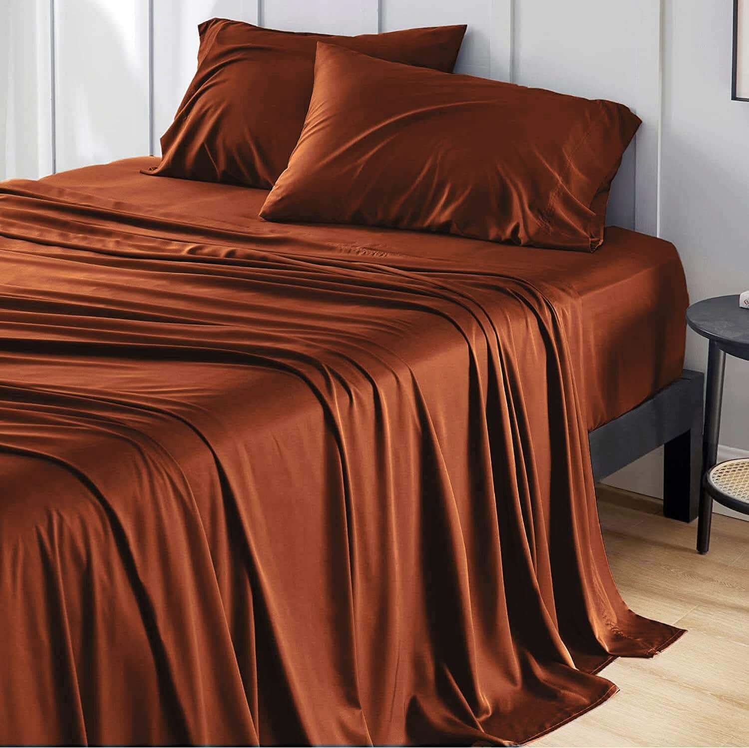 Elegant brown bamboo bed sheets draped over a bed, creating a soft and luxurious look. These bamboo sheets are ultra-soft, breathable, and hypoallergenic, offering ultimate comfort and durability for a restful sleep.