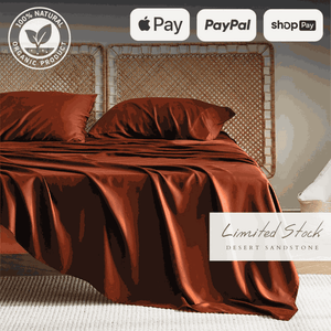 Rich brown bamboo bed sheets elegantly draped over a bed, offering a warm and sophisticated look. These bamboo sheets are ultra-soft, breathable, and hypoallergenic, providing exceptional comfort and durability for a restful sleep.