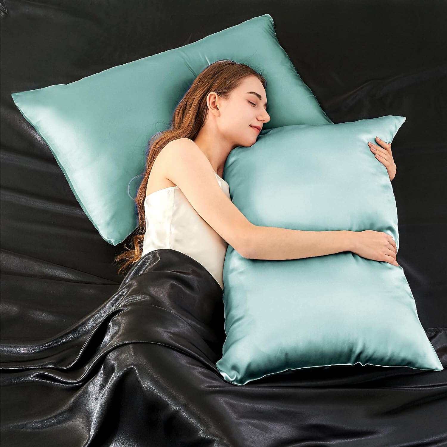 Woman resting on a luxurious light blue silk pillow case, highlighting its ultra-soft and smooth texture. This silk pillow case is designed for superior comfort, hair protection, and a breathable, skin-friendly sleep experience.