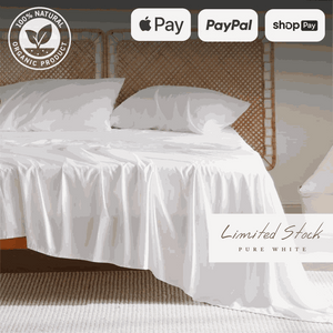 Soft and luxurious bamboo bed sheets elegantly draped over a bed, offering a breathable and hypoallergenic sleep experience. These bamboo sheets provide ultimate comfort, moisture-wicking properties, and durability for a restful night