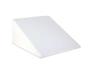 White wedge pillow for back, neck, and leg support.