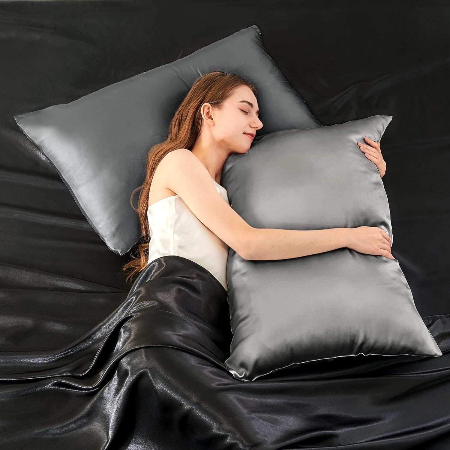 Woman resting on a luxurious silver silk pillow case, highlighting its ultra-soft and smooth texture. This silk pillow case is designed for superior comfort, hair protection, and a breathable, skin-friendly sleep experience