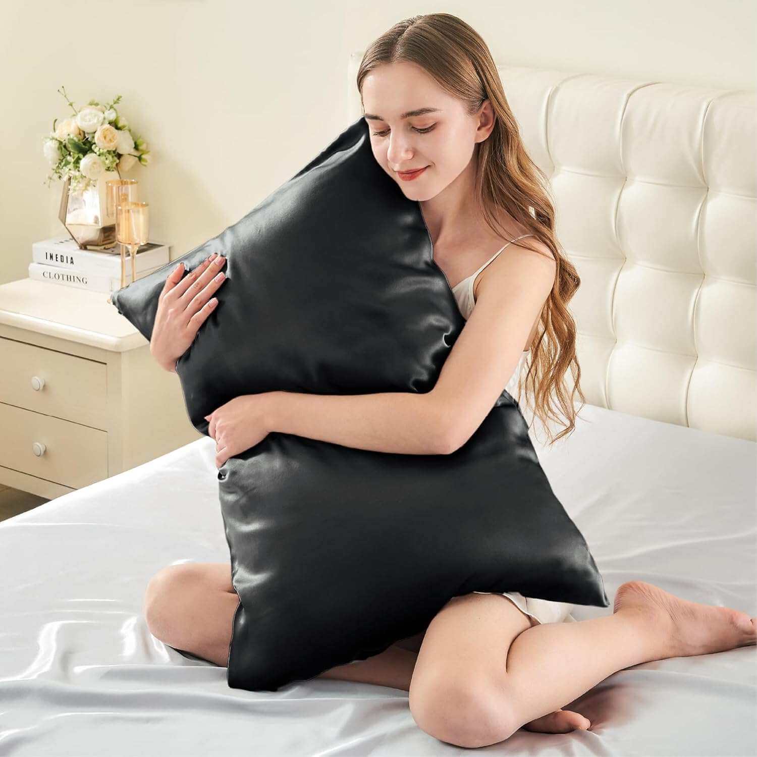 Woman embracing a luxurious black silk pillow case, highlighting its ultra-soft and smooth texture. This silk pillow case is designed for ultimate comfort, hair protection, and a breathable, skin-friendly sleep experience
