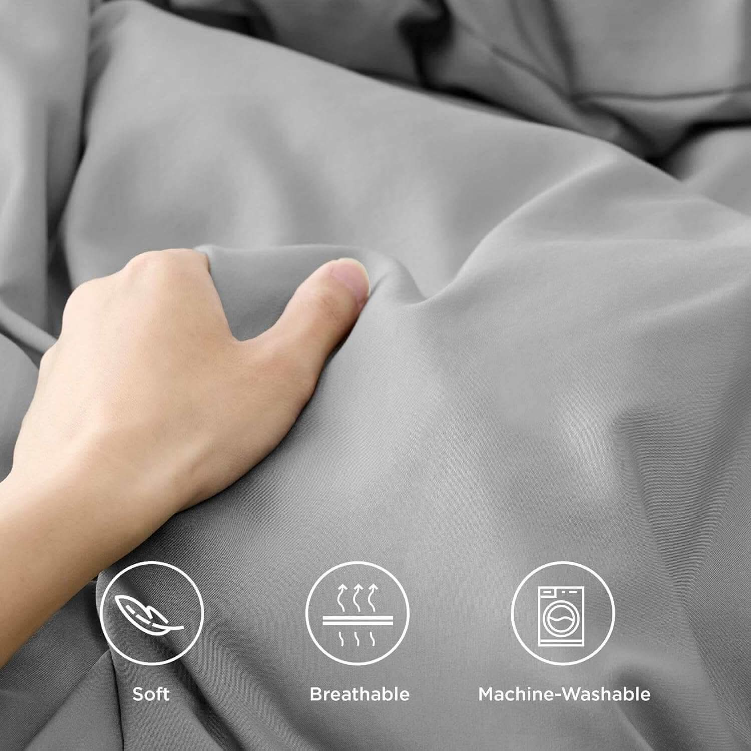 Hand holding soft, breathable, and machine-washable light grey fabric with icons for softness, breathability, and washability.