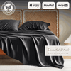 Luxurious black bamboo bed sheets draped over a bed, offering a sleek and modern look. These bamboo sheets are ultra-soft, breathable, and hypoallergenic, ensuring a comfortable and restful sleep experience