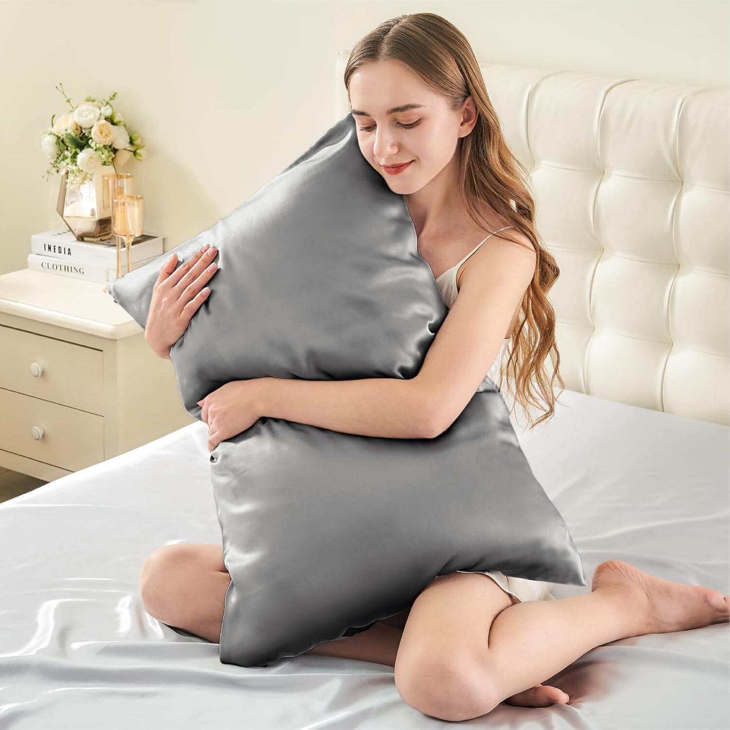 Woman embracing a luxurious silver silk pillow case, highlighting its ultra-soft and smooth texture. This silk pillow case is designed for ultimate comfort, hair protection, and a breathable, skin-friendly sleep experience.