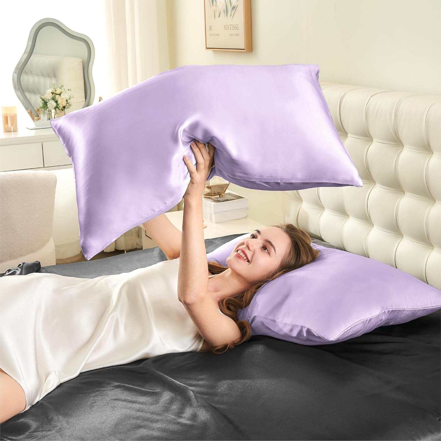 Woman joyfully tossing a lavender silk pillow case in the air, highlighting its smooth, soft, and luxurious texture. This silk pillow case is designed for superior comfort, hair protection, and a breathable, skin-friendly sleep experience