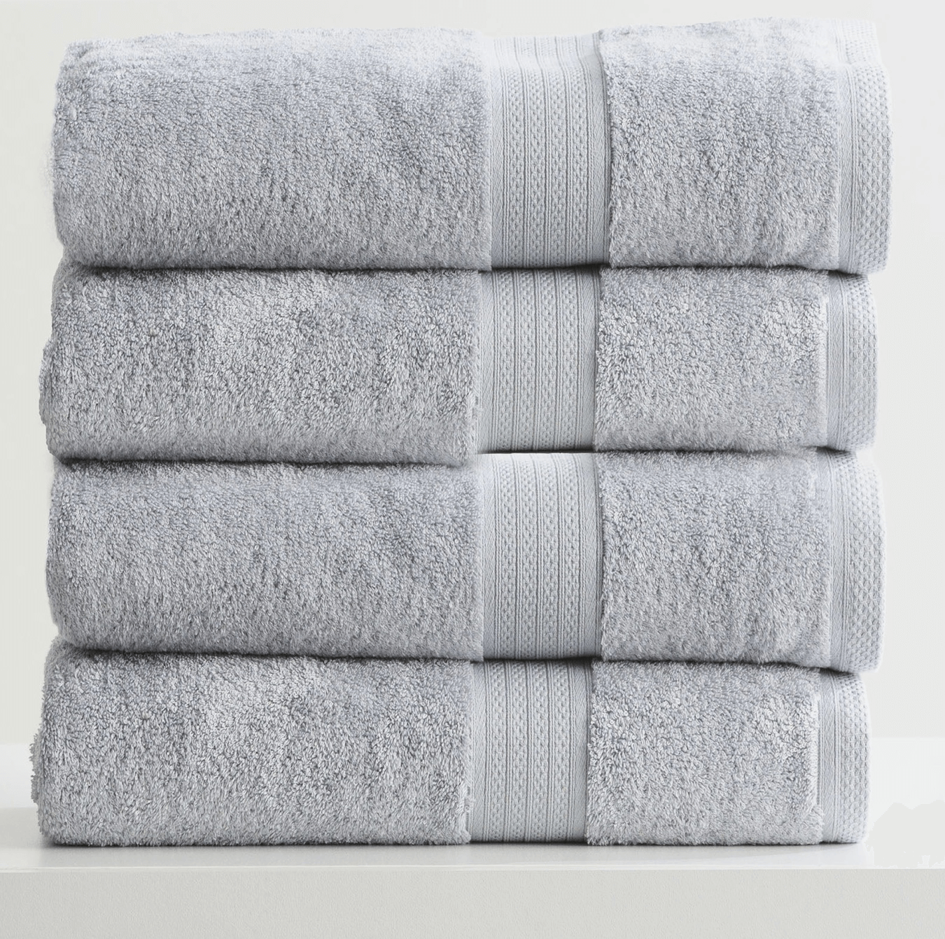 Stack of four folded Adorearth™ organic bamboo towels in light gray