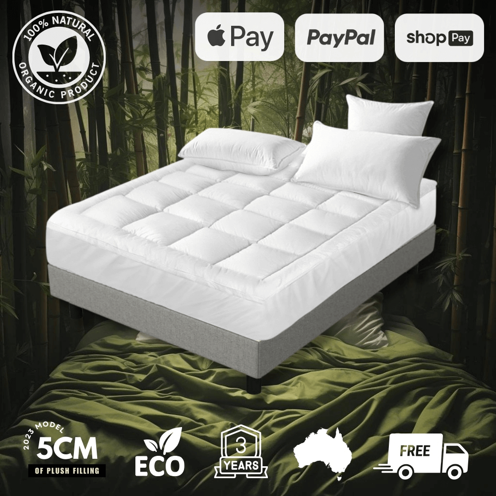 Bamboo mattress protector on a bed for soft, waterproof, and eco-friendly protection.